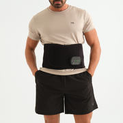 Man wearing the WAGNUM ThermaRelief PRO Waist with heating and vibration technology for pain relief, muscle relaxation, and better circulation.